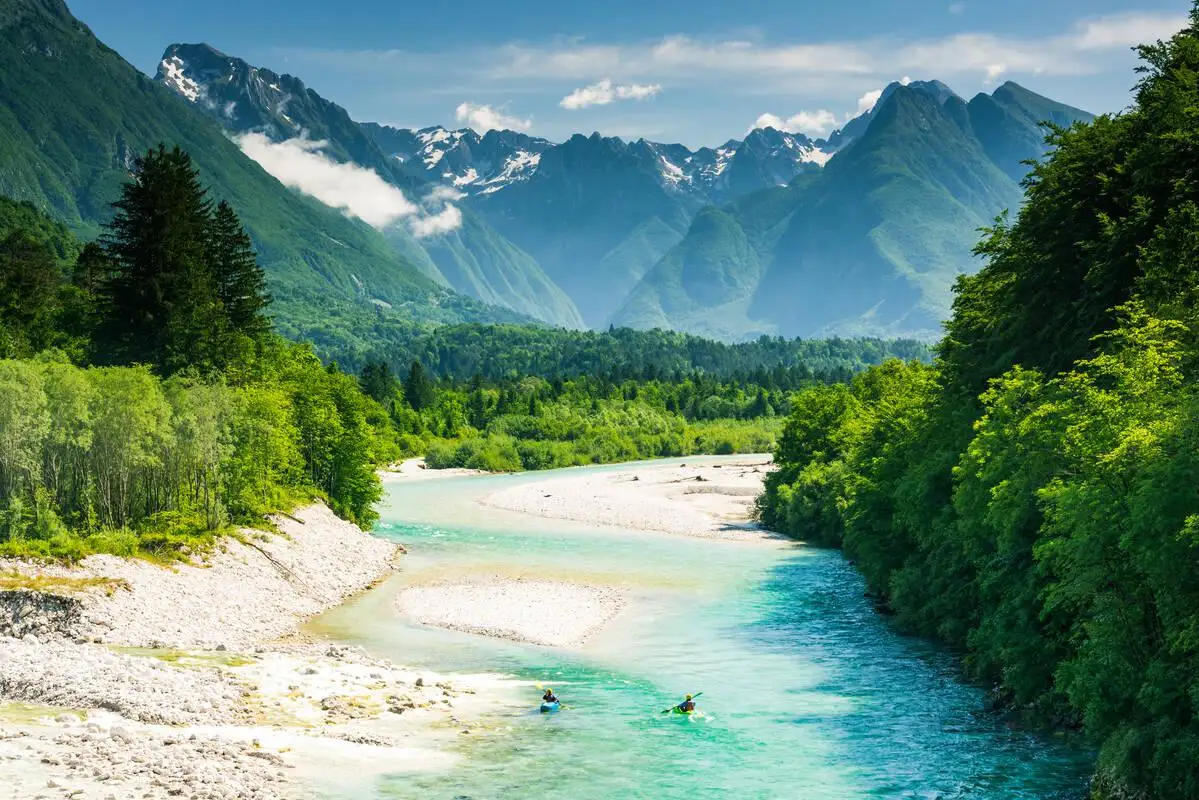 Turquoise Soča River winding through a green alpine valley near Bovec