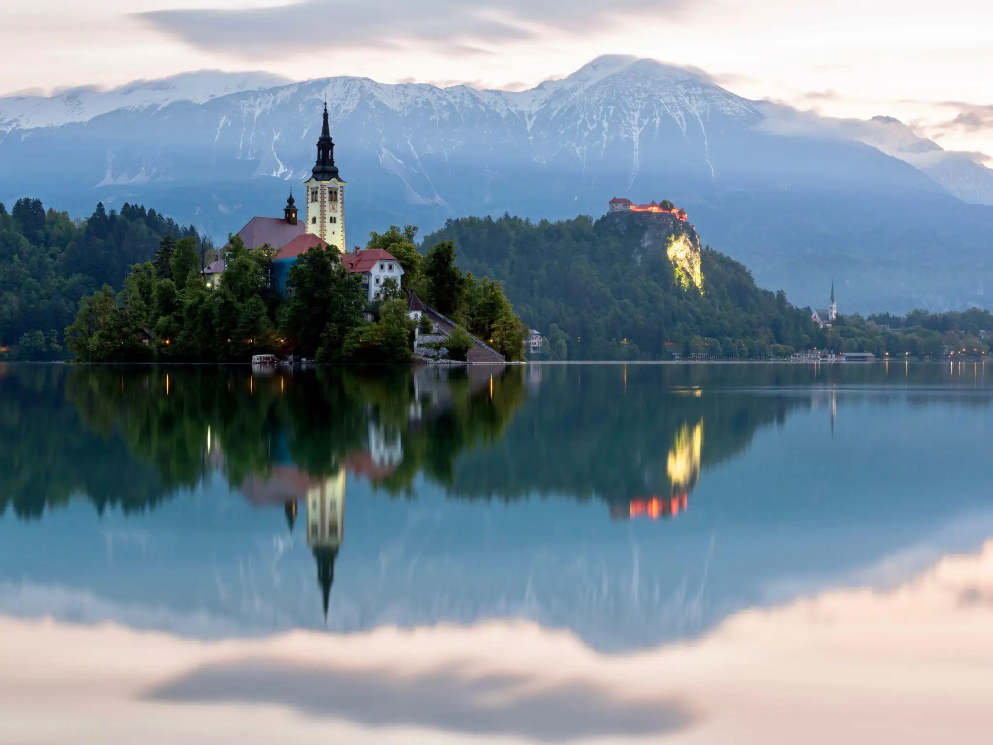 Lake Bled island, church and castle with the Julian Alps in the background